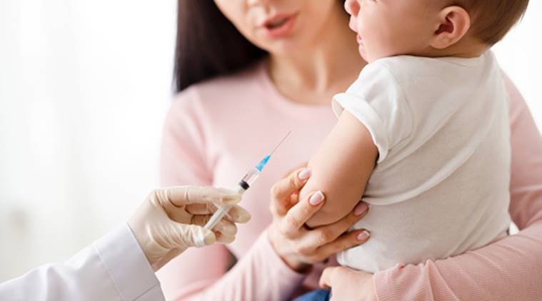 Vaccination and immunity strengthening. Doctor giving intramuscular injection to little baby in arm